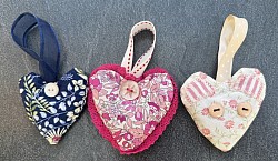 Lavender Bags in heart shape in sets of three. Contains real Lavender Sprigs.